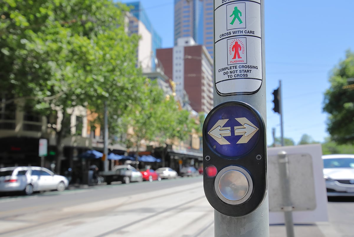 Pedestrian Button at Traffic Lights with the raised arrow to indicate direction visible
